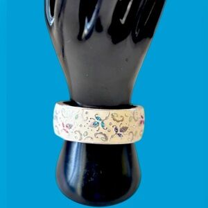 Brighton La Farfalla Round Bangle bracelet. This hinged bangle has flowers.